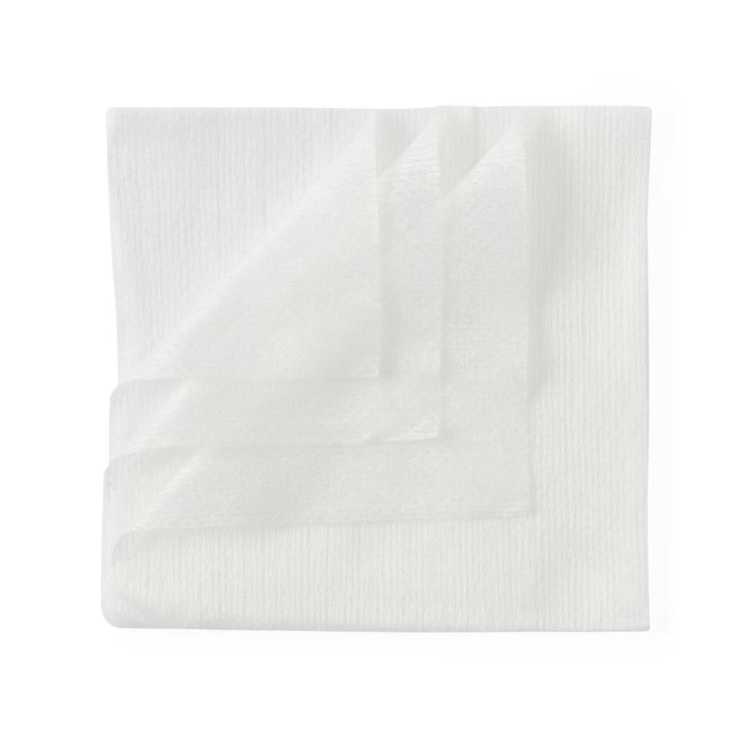 A stack of three Medline Disposable Exam Capes 30" x 21" | Tissue Poly Tissue Gown, folded and white, is arranged neatly on a flat surface against a white background.