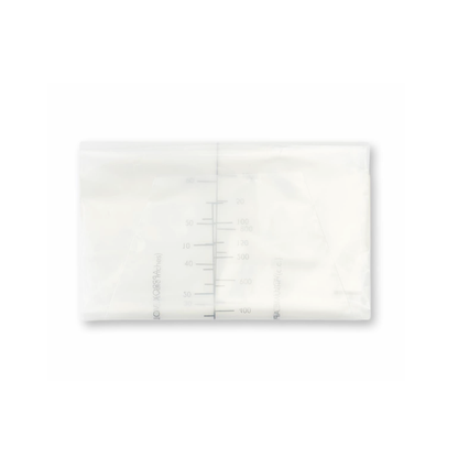 A transparent breast milk storage bag filled with milk lies flat, featuring milliliter measurement markings on the front similar to those on Medline Emesis Bags with Paper Funnel.