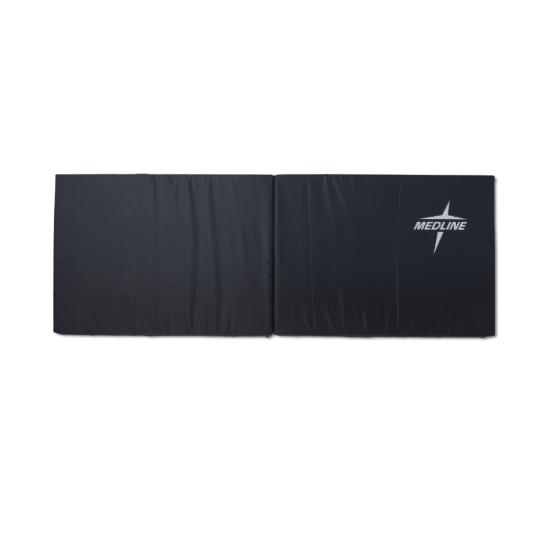 The Medline Bi-Fold Fall Mat is a black, foldable safety mat with light padding for comfort and protection. It lays flat and features the white Medline logo with a stylized star on the right side.