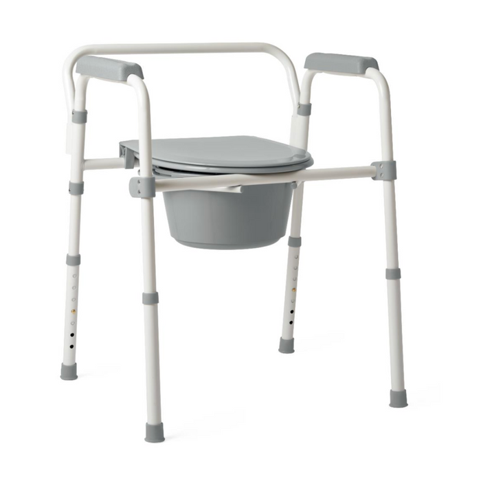 The Medline Steel 3-in-1 Folding Commode features a grey seat and bucket, adjustable height legs with rubber caps for stability, and a robust steel frame with grey armrests for durability and support.