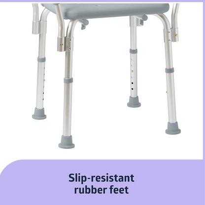 Close-up of the Medline Shower Chair with Backrest and Padded Armrests showcasing adjustable metal legs with height-adjustment holes, non-slip rubber feet for added safety, and a gray seat.