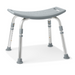 The Medline Bariatric Knockdown Portable Shower Chair without Back is gray, lightweight, and features a curved seat with drainage holes. It has sturdy, adjustable aluminum legs with rubberized feet for stability and a built-in handle on one side for easy carrying.