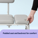 A hand presses on the padded gray seat and matching backrest of the Medline Bariatric Padded Bathtub Transfer Bench—offering comfort and adjustable height, ideal for use as a bath and shower transfer seat.