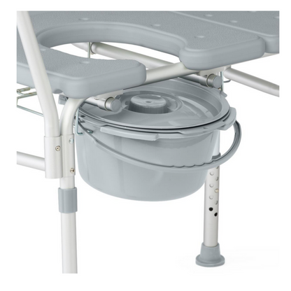 The Medline Bariatric Combination Transfer Bench and Commode is a gray chair with a built-in, removable bucket and lid. It’s designed for mobility challenges, featuring adjustable-height legs with rubber tips for enhanced stability and safer transfers.