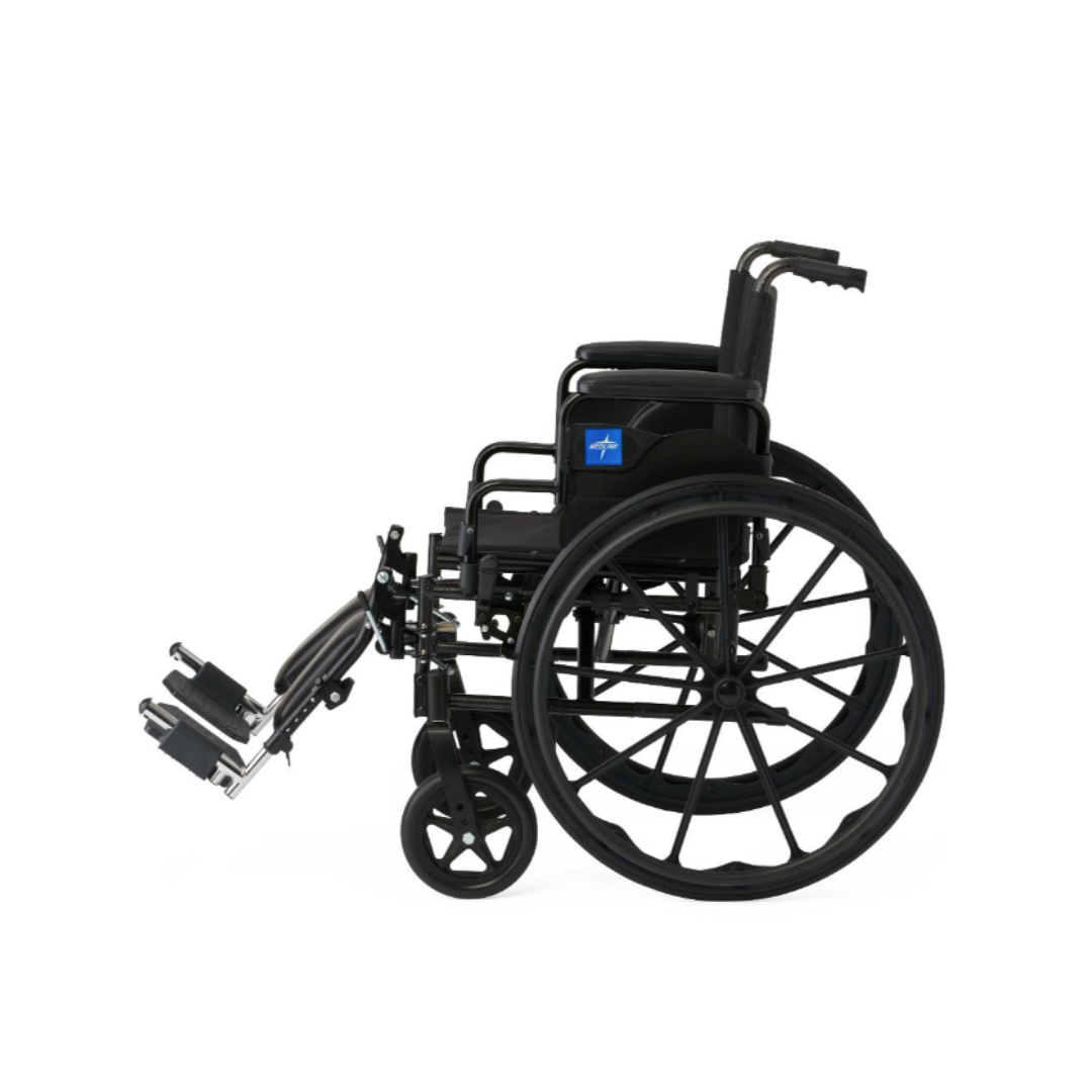 A side view of the Medline Guardian K4 Wheelchair with Desk-Length Arms, featuring large rear wheels, small front wheels, padded armrests, and extended footrests, is displayed against a plain white background.