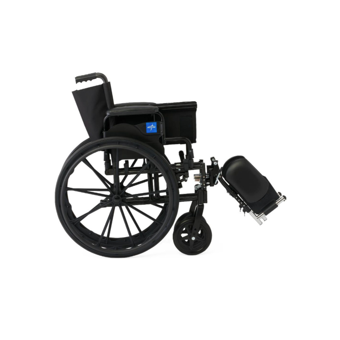 A Medline Guardian K4 Wheelchair with desk-length arms, large rear wheels, and a single elevated leg rest faces left against a white background.