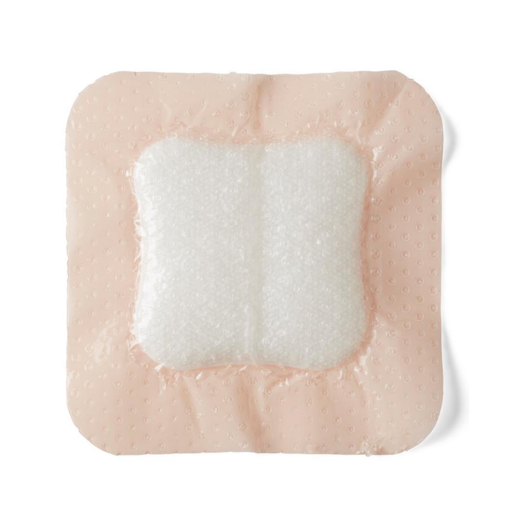 Medline Optifoam Gentle LQ Silicone-Faced Foam Wound Dressings are square adhesive bandages with a thick white foam center and light beige silicone border, designed for advanced wound care, shown against a white background.