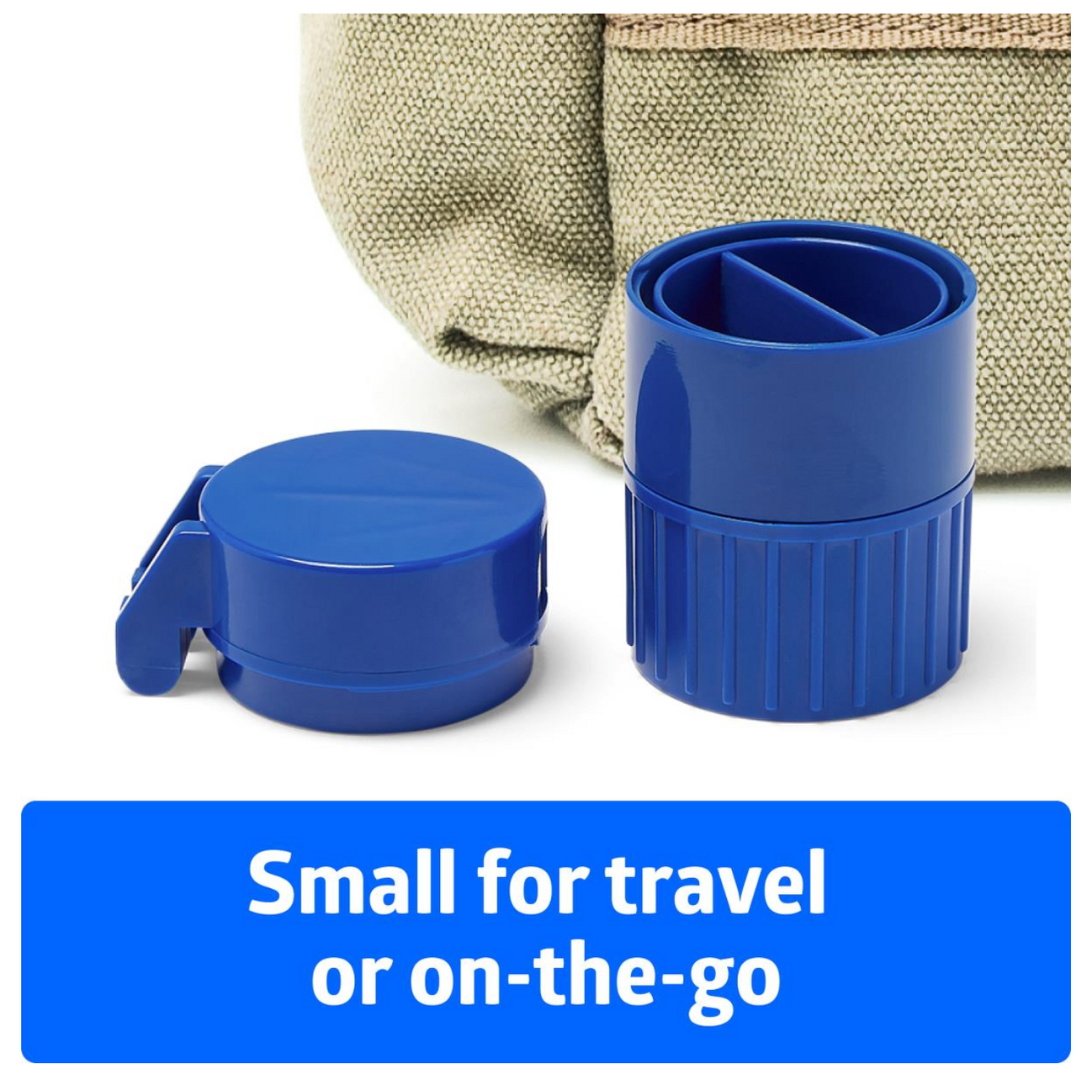 A compact blue Medline Pill Crusher and Splitter Combo Device, opened to reveal its compartments for medication management, sits beside a textured beige bag. Text below reads: Small for travel or on-the-go.