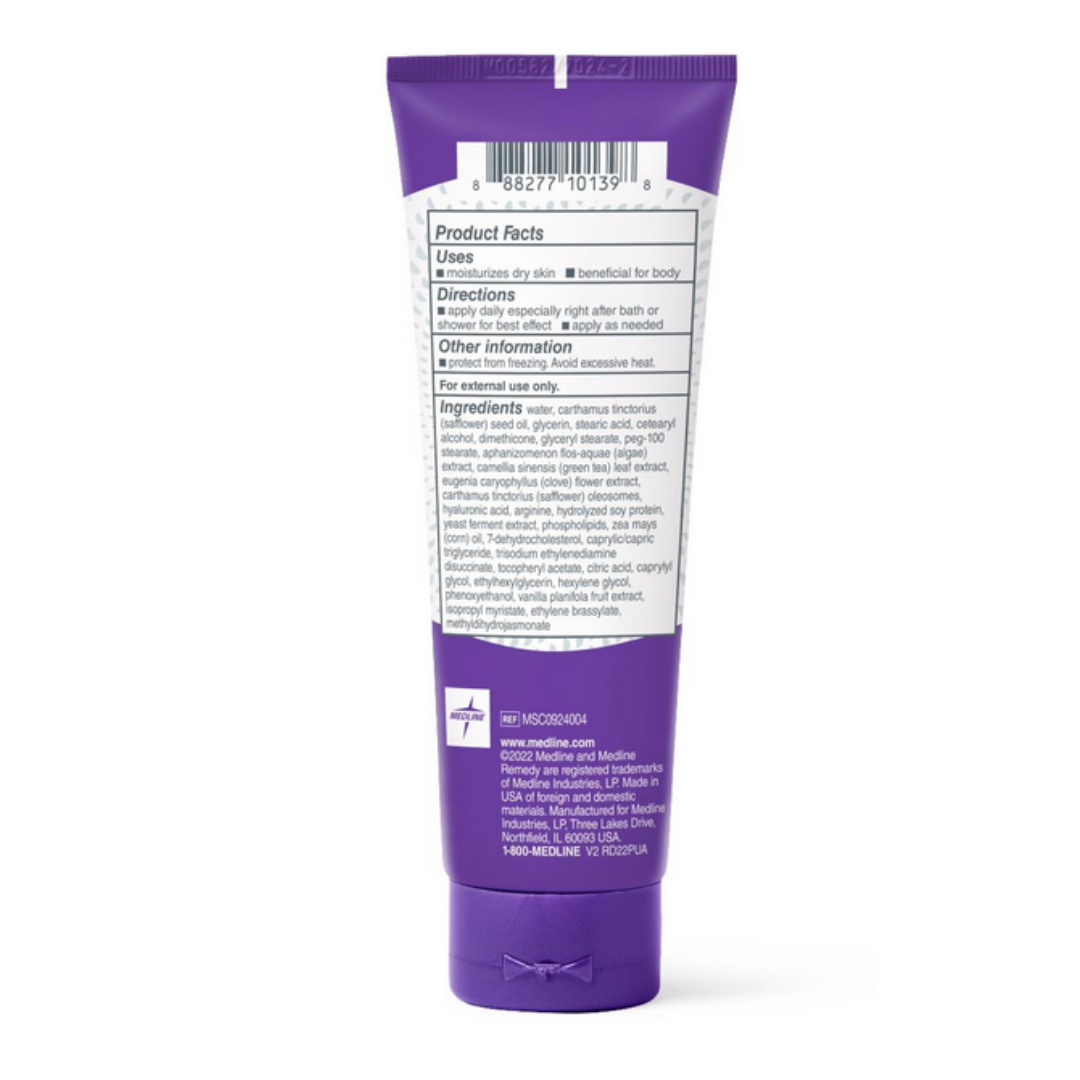 A purple tube of Medline Remedy Clinical Skin Cream - Full Body Lotion is shown from the back, featuring a white label with black text displaying the barcode, product facts, directions, ingredients, and manufacturer info. Provides lasting hydration.