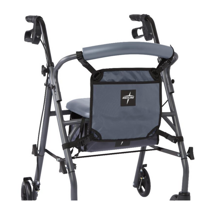 A gray walker with four wheels, featuring a padded seat, backrest, hand brakes, and a Medline Rollator Hanging Storage bag made of durable nylon with a label attached to the back, all set against a white background.