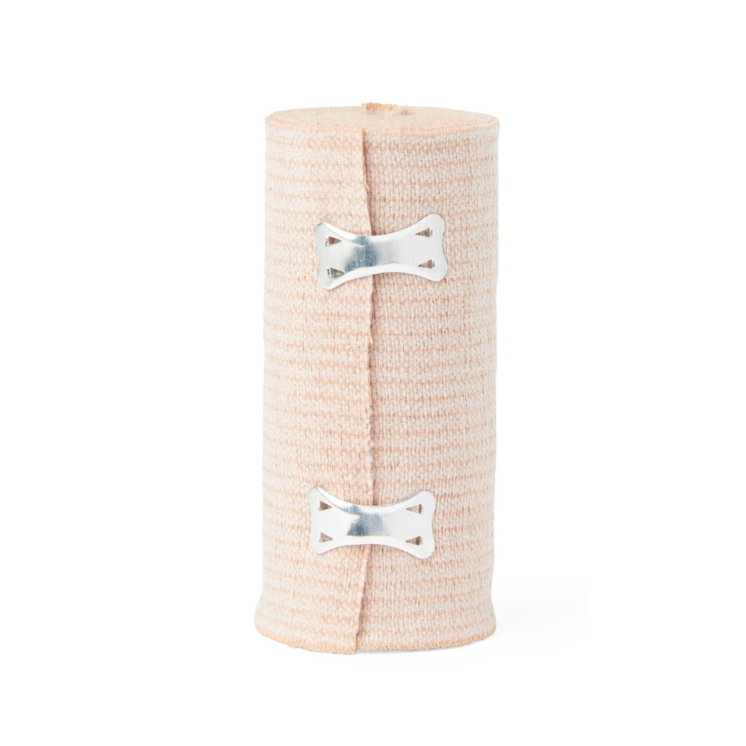 A rolled Medline Soft-Wrap Elastic Bandage in beige, secured with two silver metal clips, stands upright against a white background.