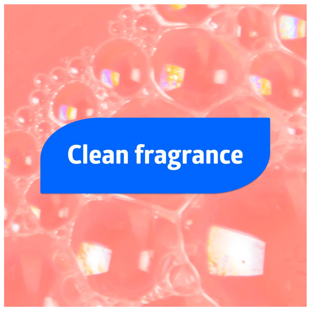 Close-up of soap bubbles on a pink background with a blue speech bubble in the center displaying "Clean fragrance" in white, highlighting the freshness of Medline Spectrum Antibacterial Liquid Hand Soap.