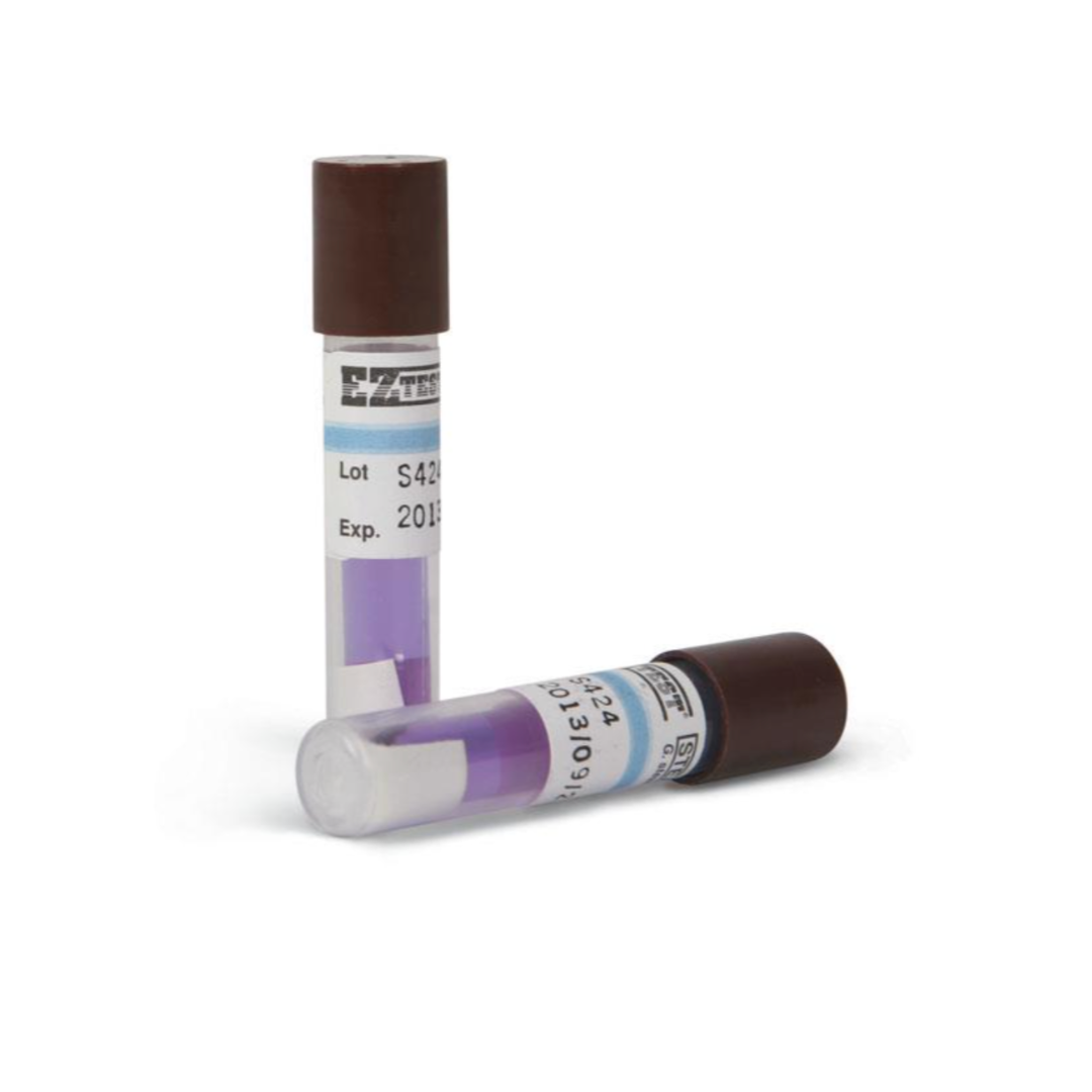 Two Medline Standard Biological Steam Indicator blood collection tubes with brown caps and purple liquid, one upright and one horizontal. Each has a white label with text, barcode, lot/expiration info, and a steam indicator.
