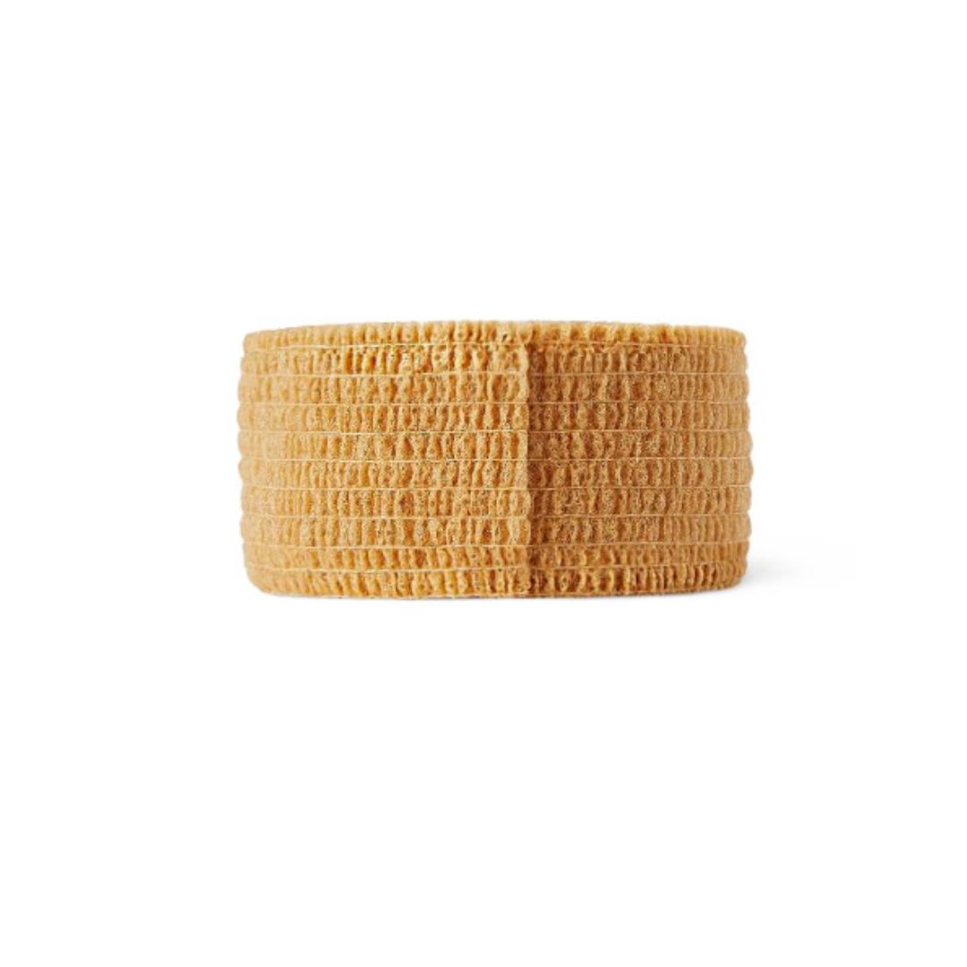 A Medline Sterile Self-Adherent Latex Wrap in tan, with a ribbed, textured surface, is neatly coiled and displayed against a white background.