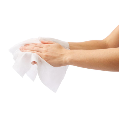 Two hands are wiping with a Medline Ultrasoft Disposable Dry Cleansing Cloth against a white background, highlighting these gentle wipes ideal for sensitive skin and incontinence care.