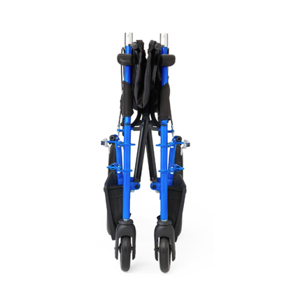 The Medline Zero G Ultralite Transport Chair in blue features an aluminum frame, foldable design, black fabric seat, storage pouches, and four black wheels. Shown from the front in its fully collapsed position.