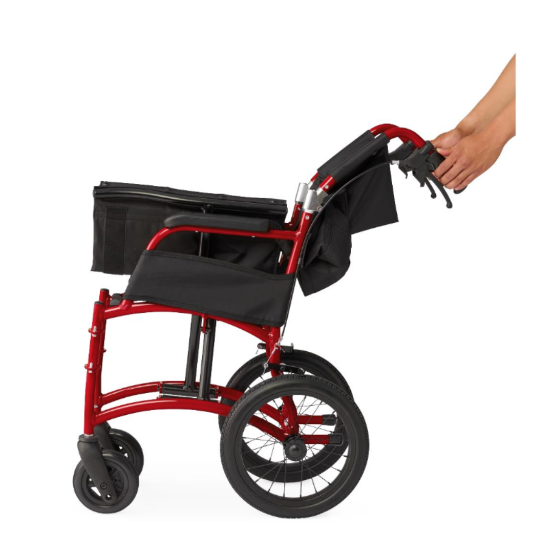 A person’s hands grip the handles of a Medline Zero G Ultralite Transport Chair, featuring a lightweight foldable aluminum frame, shown from the side against a plain white background.