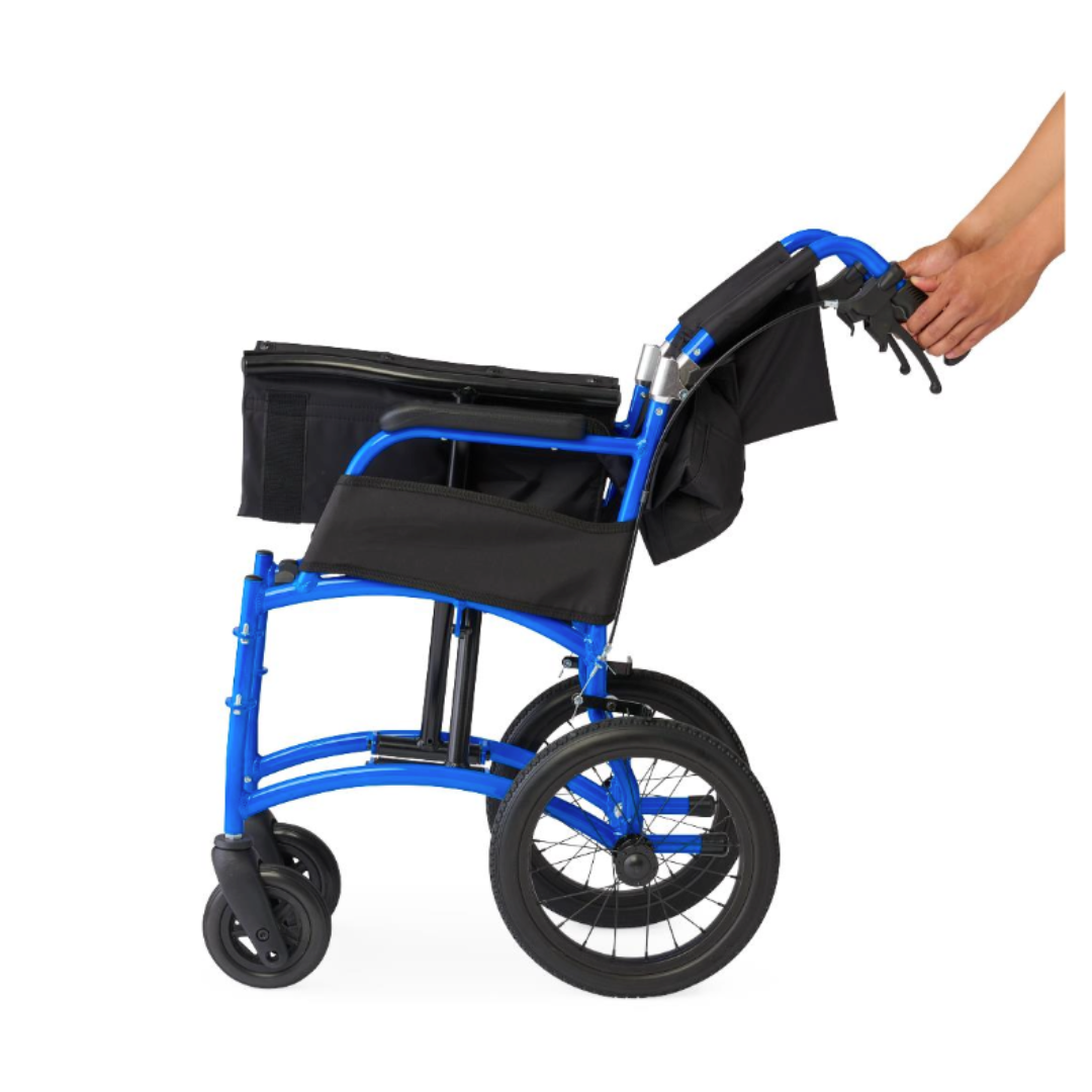 A hand folds the Medline Zero G Ultralite Transport Chair, a blue, lightweight aluminum model with black seat and accessories, featuring a foldable design, shown from the side against a white background.