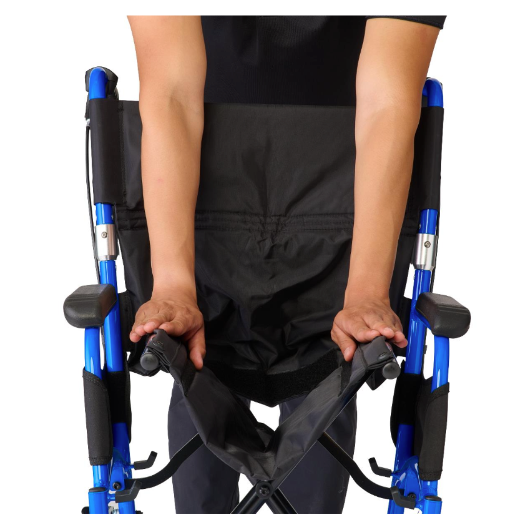 A person is folding a Medline Zero G Ultralite Transport Chair, highlighting its lightweight, foldable design and partially collapsed aluminum frame.