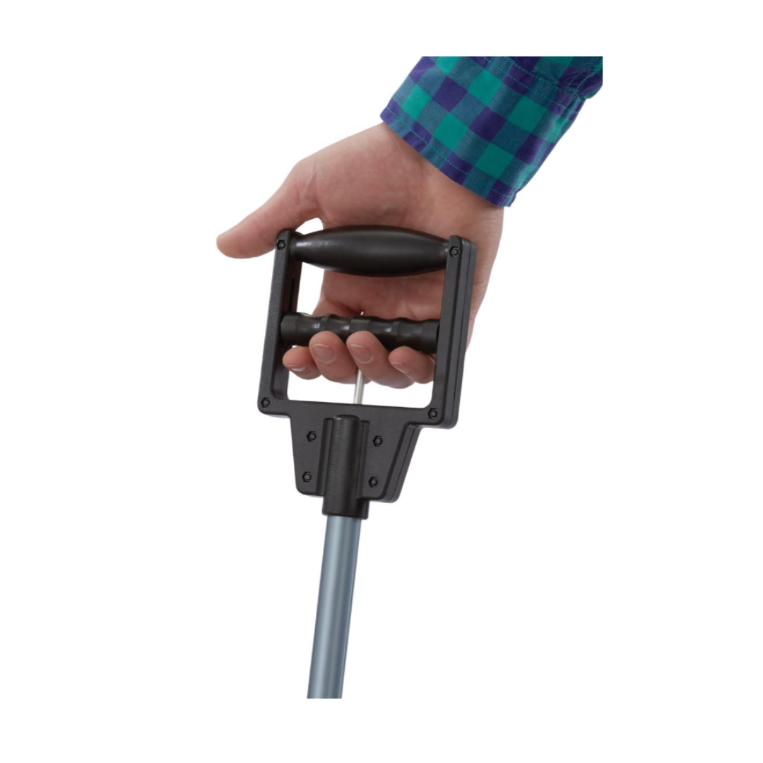 A person in a blue and green plaid shirt grips the black ergonomic handle of a Medline 31" Reacher Grabber Tool with one hand.
