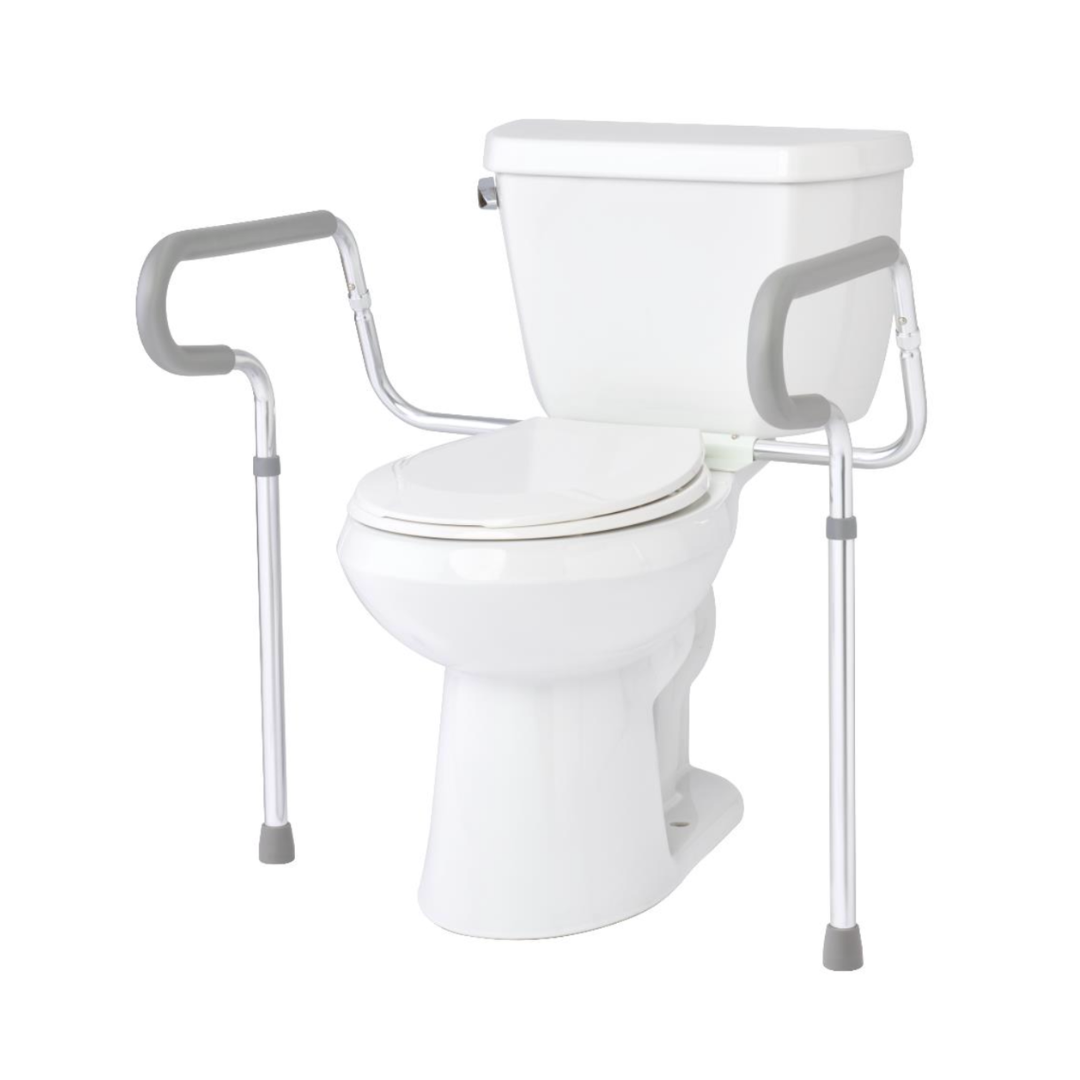 A white toilet with the Medline Aluminum Toilet Safety Rail featuring two gray and silver adjustable rails attached on each side, providing reliable support for users who need assistance while sitting or standing.