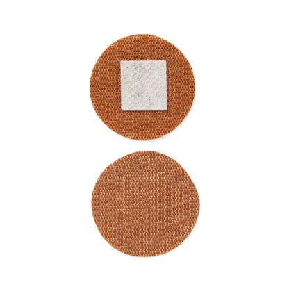 Two round brown Medline CURAD Flex-Fabric Adhesive Spot Bandages are shown. The top patch features a small white center, while the bottom one is plain. Both offer a textured, flexible surface for comfortable protection.