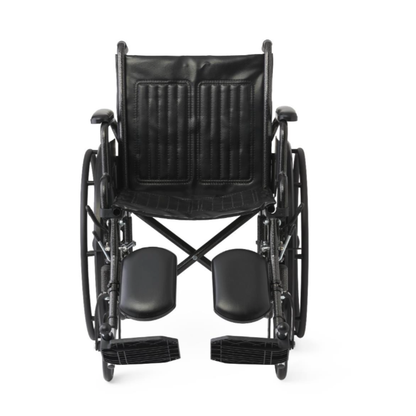 The Medline Guardian K1 Wheelchair features durable black vinyl upholstery, padded seat and backrest, footrests, and large rear wheels for daily use. Shown from the front against a white background.