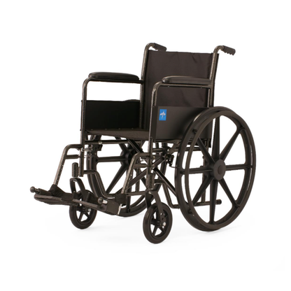 The Medline Guardian K1 Wheelchair features durable black nylon upholstery, large rear wheels, small front wheels, footrests, and armrests for everyday use, shown on a white background.