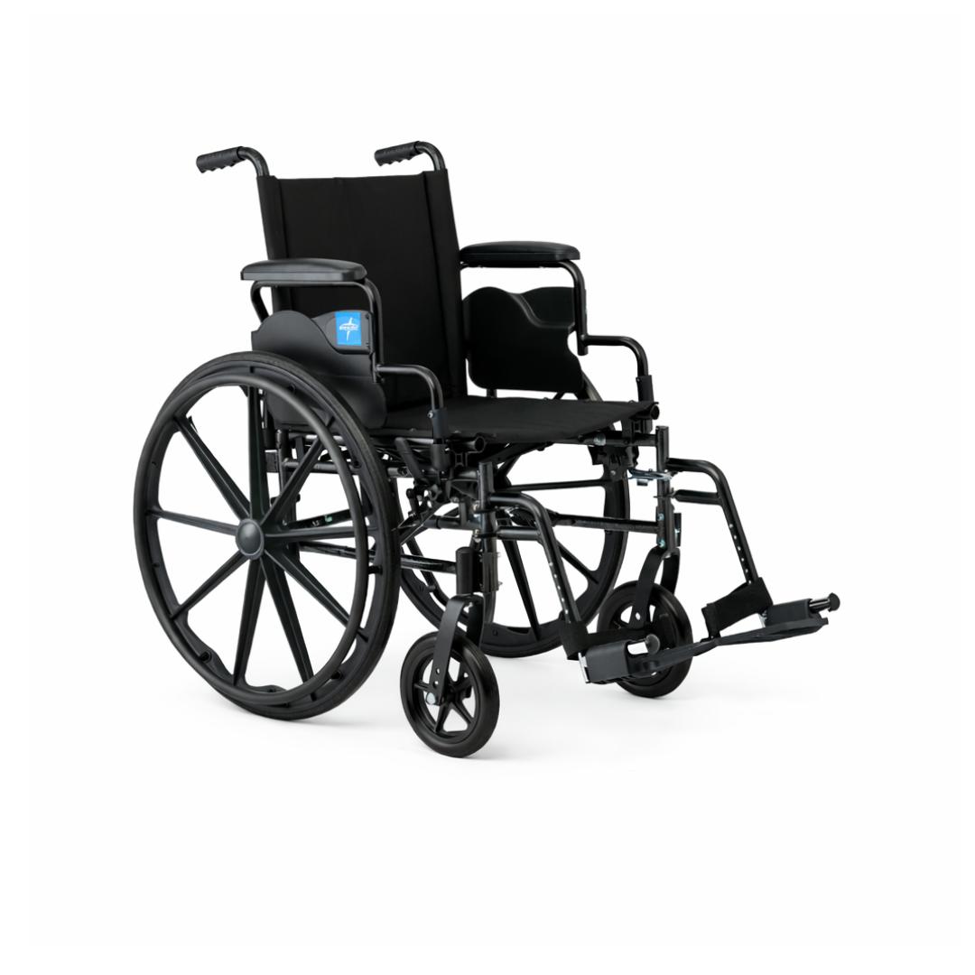 The Medline Guardian K4 Wheelchair with Desk-Length Arms is black, features large rear wheels, smaller front wheels, padded armrests, footrests, and has a blue sticker on the side. It is shown against a white background.