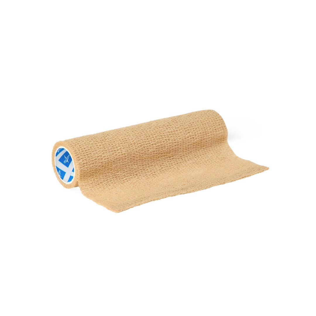 A tan Medline Non-Sterile Tam Self-Adherent Wrap Short Roll is partially unrolled on a white background, revealing a blue and white label on the inner side of this textured, self-adherent wrap.
