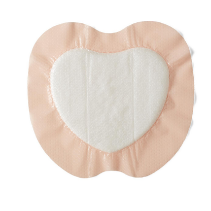 Medline Optifoam Gentle LQ Silicone-Faced Foam Wound Dressing features a heart shape with a white absorbent pad and light pink silicone border, ideal for gentle wound care. Shown on a white background.