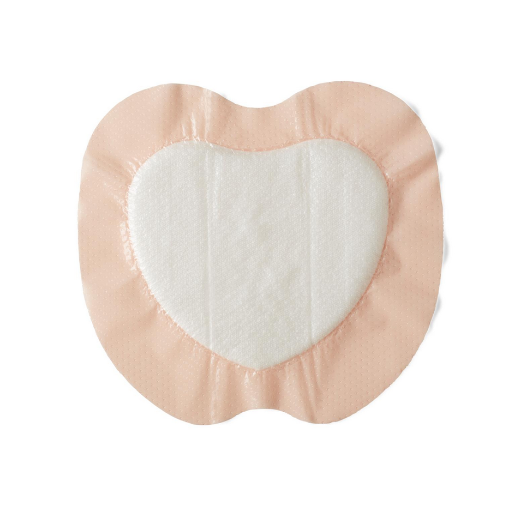 Medline Optifoam Gentle SA Silicone-Faced Foam Wound Dressings: heart-shaped, light pink border with white superabsorbent foam center—ideal for gentle wound care. Shown on a white background.
