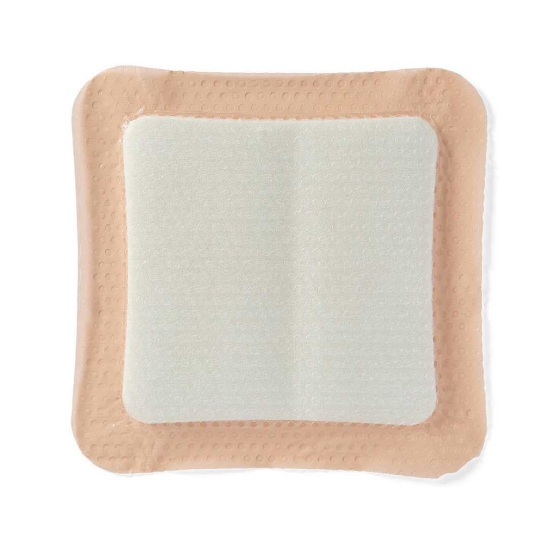 Medline Optifoam Gentle SA Silicone-Faced Foam Wound Dressing is a square adhesive bandage with a beige border, white padded center, and silicone adhesive for wound coverage and protection.