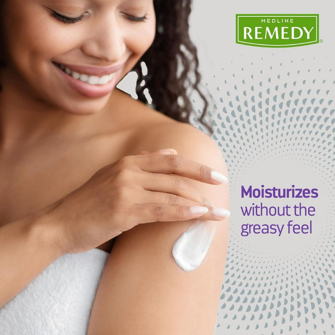 A smiling woman wrapped in a white towel applies Medline Remedy Clinical Skin Cream - Full Body Lotion to her shoulder. Text reads, “Moisturizes without the greasy feel, supporting natural moisture balance.” Remedy logo appears top right.