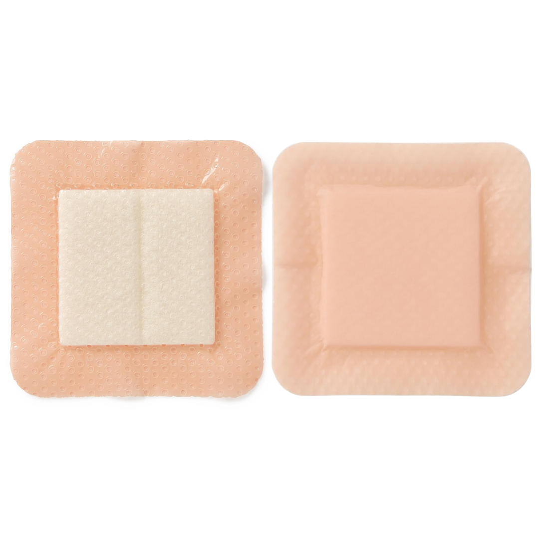 Two Medline Optifoam Gentle EX Silicone-Faced Foam Wound Dressings are shown side by side: one displays its central absorbent white pad, the other shows the smooth, flesh-toned exterior—ideal for advanced wound care with a superabsorbent core.