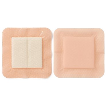 Two Medline Optifoam Gentle EX Silicone-Faced Foam Wound Dressings are shown side by side: one displays its central absorbent white pad, the other shows the smooth, flesh-toned exterior—ideal for advanced wound care with a superabsorbent core.