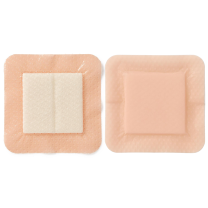Two Medline Optifoam Gentle EX Silicone-Faced Foam Wound Dressings are shown side by side: one displays its central absorbent white pad, the other shows the smooth, flesh-toned exterior—ideal for advanced wound care with a superabsorbent core.