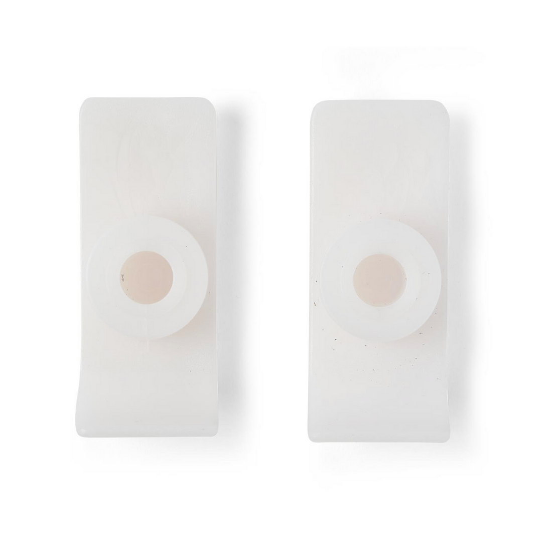 Two Medline Ski Gliders for Walkers, featuring white plastic construction and central circular holes resembling walker leg caps, are displayed side by side on a plain white background.