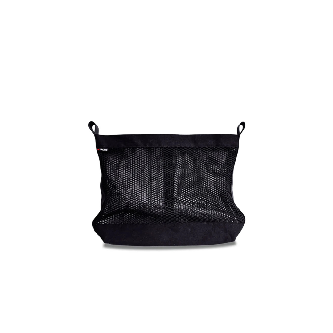 Mesh Bag For ByAcre Rollators shown empty and slightly crumpled at the bottom, with two small loops at the top corners for easy attachment. Displayed on a white background, this black mesh bag is a practical accessory designed to conveniently carry essentials during your outdoor rollator adventures.