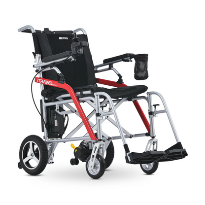 The Metro Mobility iTravel Lite Portable Powerchair is a lightweight, foldable electric wheelchair with a black seat, red and silver frame, small front wheels, large rear wheels, and a black armrest pouch—ideal for airplane travel.
