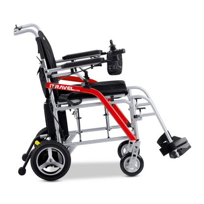 Side view of the Metro Mobility iTravel Lite Portable Powerchair—a modern, lightweight, airplane-friendly electric wheelchair with a red and silver frame, black seat, padded armrests, footrests, and a compact control panel for easy travel.
