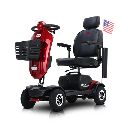 The metro Mobility MAX Plus Scooter is a red, four-wheel model with a black seat, front basket, 300W motor, and up to 16-mile range. It displays an American flag on a rear pole, with METRO on the seat and MAX PLUS on the base.