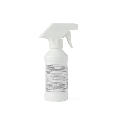 A white plastic spray bottle with a trigger nozzle stands against a plain background. Its rectangular label features product details for Medline MicroKlenz Antimicrobial First Aid Antiseptic.