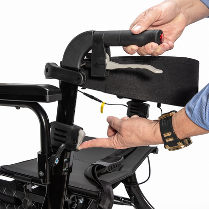 Close-up of hands adjusting the handlebar height on a Miracle Mobility Portable 4N1 Walker Wheelchair Combo, with one hand gripping the handle and the other pointing to the adjustment lever.