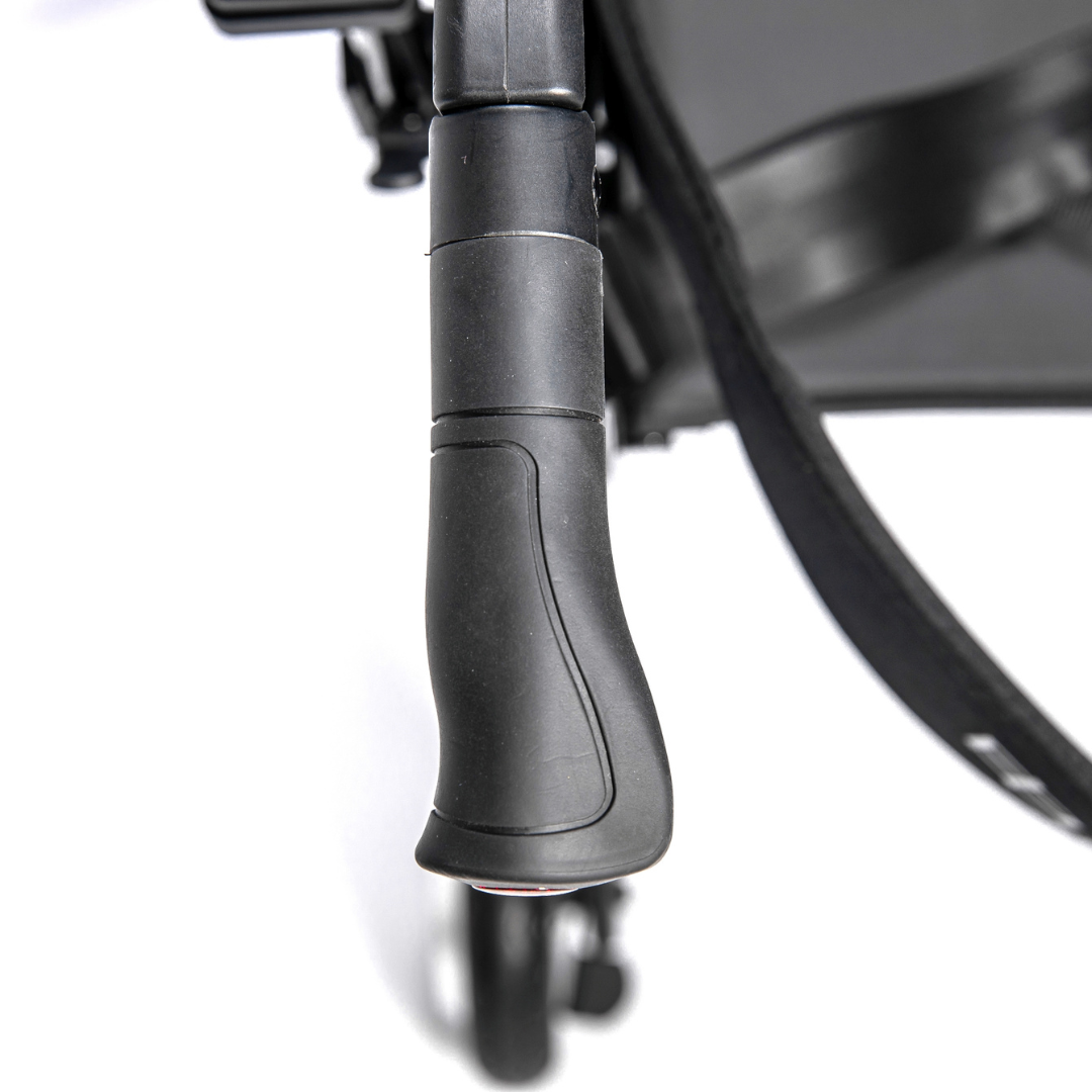 Close-up view of the Miracle Mobility Portable 4N1 Walker Wheelchair Combo’s black, textured stroller handle from above, with part of the seat and front wheel visible—showcasing this lightweight, travel-ready mobility solution.