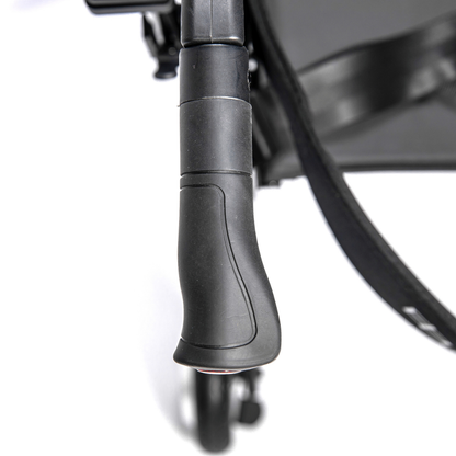Close-up view of the Miracle Mobility Portable 4N1 Walker Wheelchair Combo’s black, textured stroller handle from above, with part of the seat and front wheel visible—showcasing this lightweight, travel-ready mobility solution.