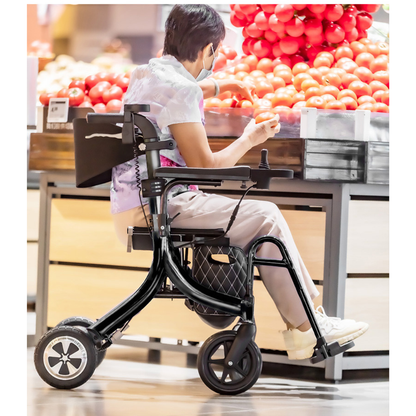 Using a Miracle Mobility Portable 4N1 Walker Wheelchair Combo, a masked person in casual attire selects tomatoes from a grocery store display.