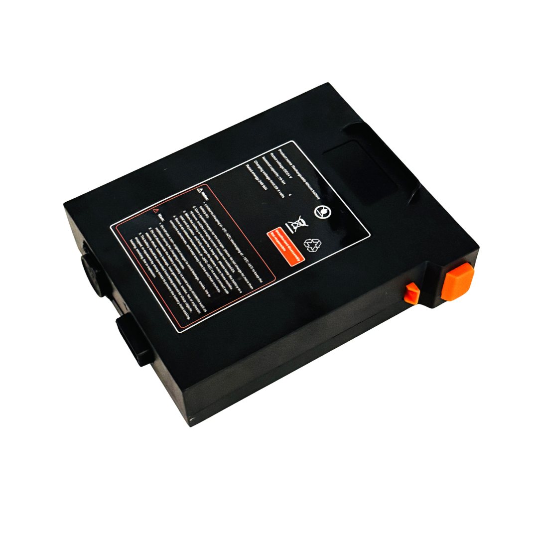 Battery for The Miracle Mobility Palladium 8500 Powerchair—rectangular black 24V 12Ah lithium pack with instruction label, orange/black connectors, and handle. Perfect as a replacement battery; shown on a white background.