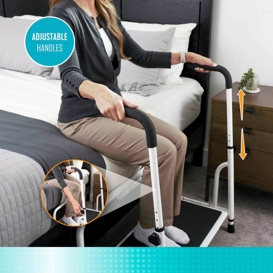 A woman sits on the bed using the Stander Step Bedside Platform with LED Lighting, featuring black adjustable handles and a non-slip step. A close-up inset highlights her grip on the rail, showcasing its adjustable design.