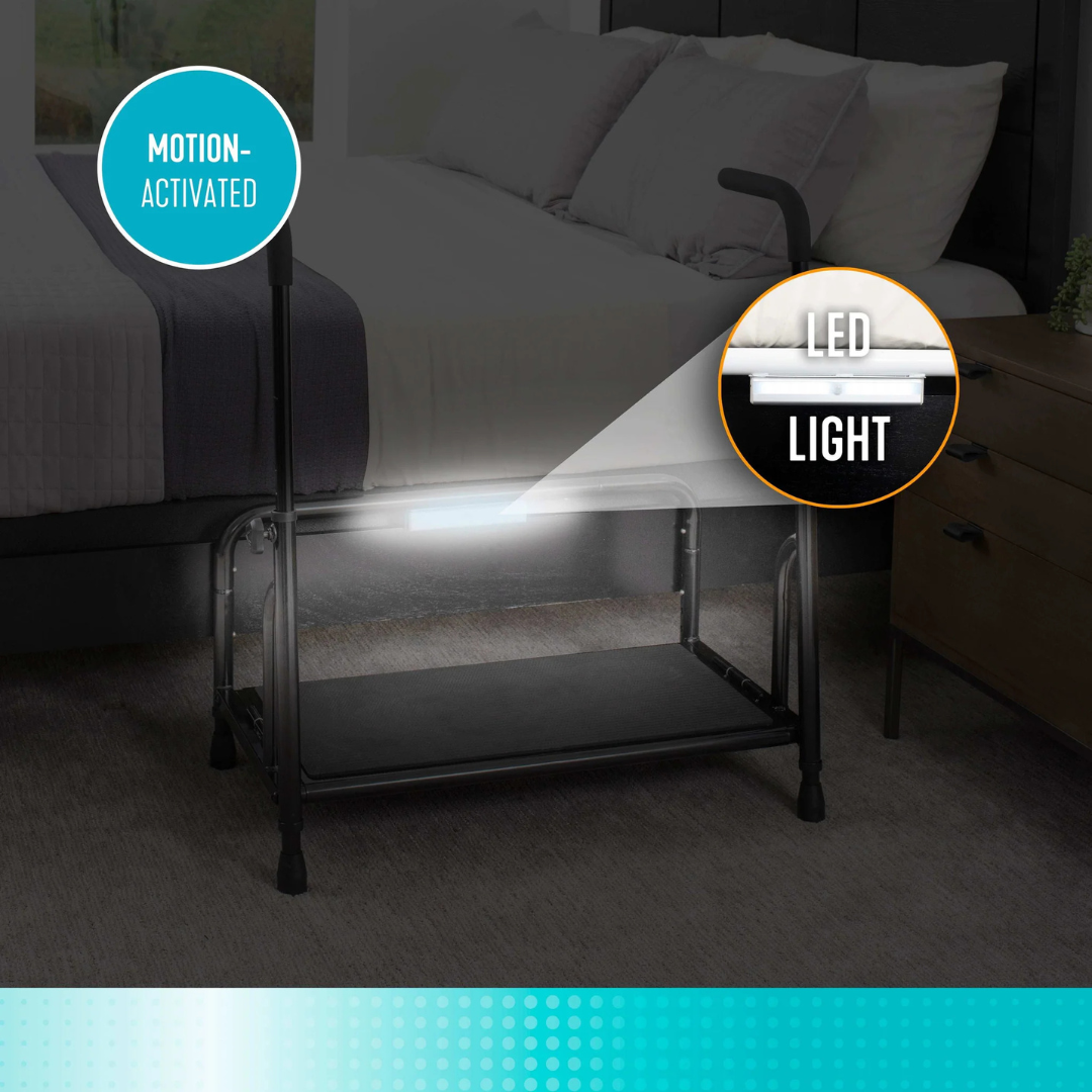 The Stander Step Bedside Platform with LED lighting is attached under a safety rail, illuminating the area and providing convenient, secure nighttime access next to the bed.